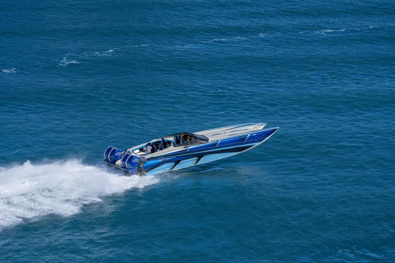 Slide: The Image of 2026 Nor-Tech 4000 Super Catamaran speeding on open blue water. - 170