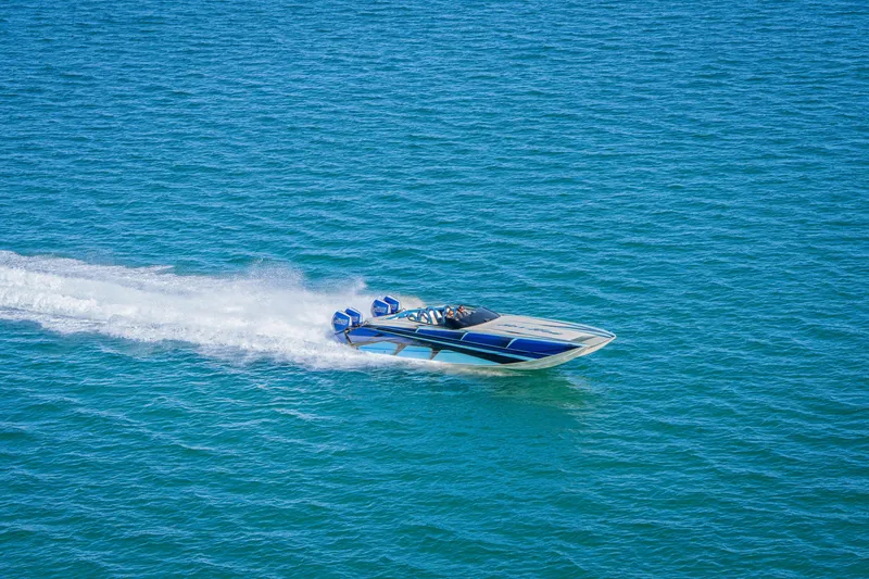 Slide: The Image of 2026 Nor-Tech 4000 Super Catamaran speeding on open water. - 18