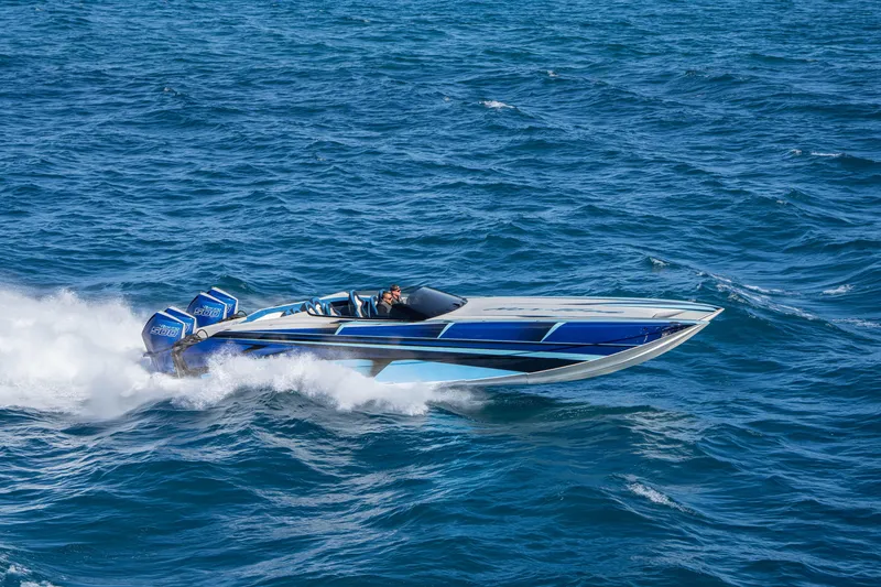 Slide: The Image of 2026 Nor-Tech 4000 Super Catamaran speeding on open ocean waters. - 184