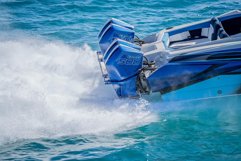 Slide: The Image of 2026 Nor-Tech 4000 Super Catamaran with dual Racing 500 engines on turquoise water. - 186