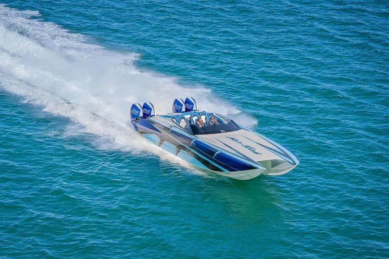 Slide: The Image of 2026 Nor-Tech 4000 Super Catamaran speeding on blue ocean waters. - 19
