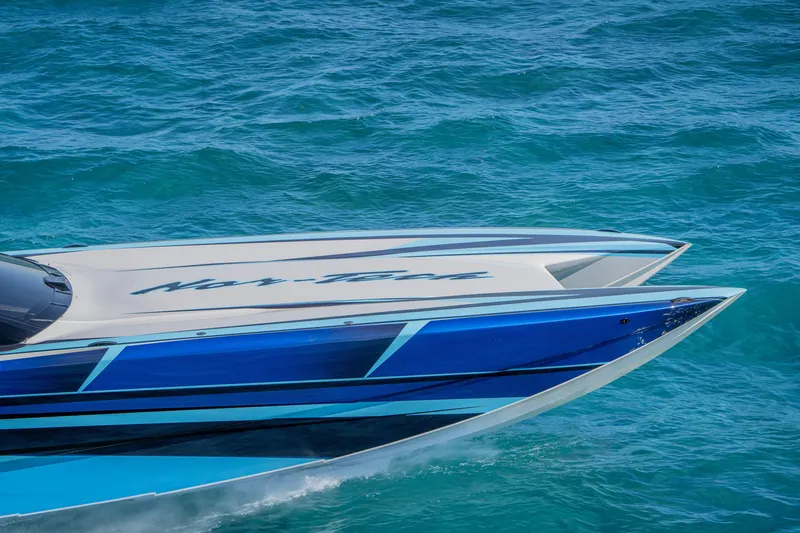 Slide: The Image of 2026 Nor-Tech 4000 Super Catamaran cruising on vibrant blue ocean waters. - 190