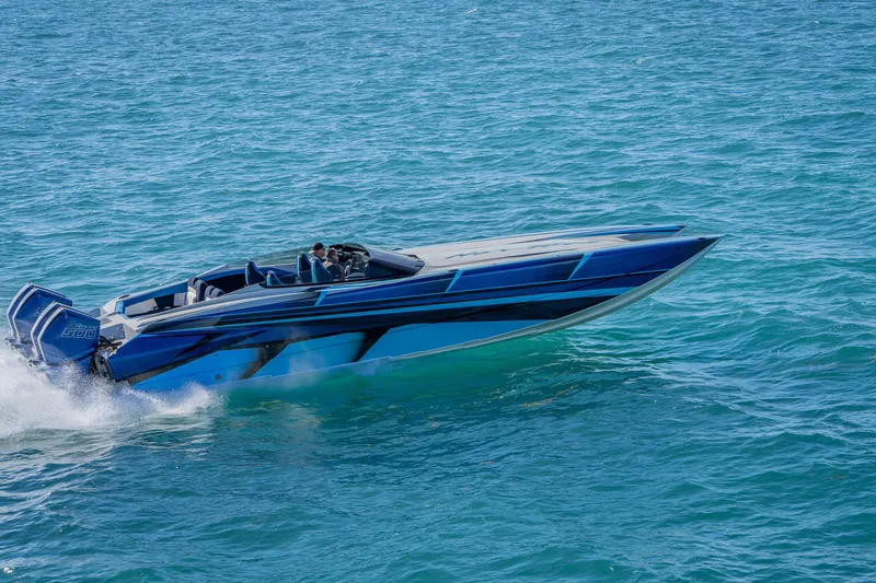 Slide: The Image of 2026 Nor-Tech 4000 Super Catamaran cruising on blue ocean waters. - 192