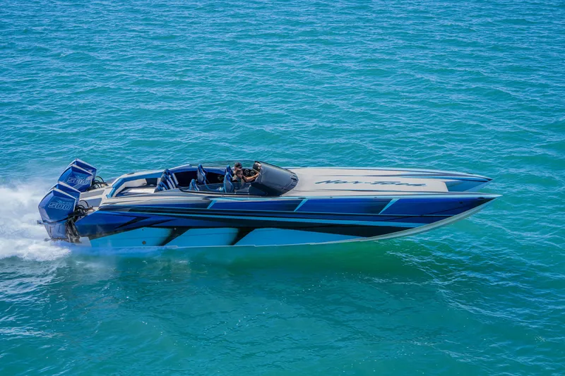 Slide: The Image of 2026 Nor-Tech 4000 Super Catamaran cruising on clear blue waters. - 194