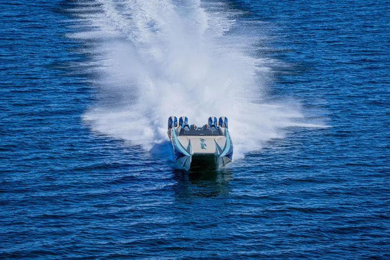 Slide: The Image of 2026 Nor-Tech 4000 Super Catamaran speeding on open water, creating a dramatic wake. - 195
