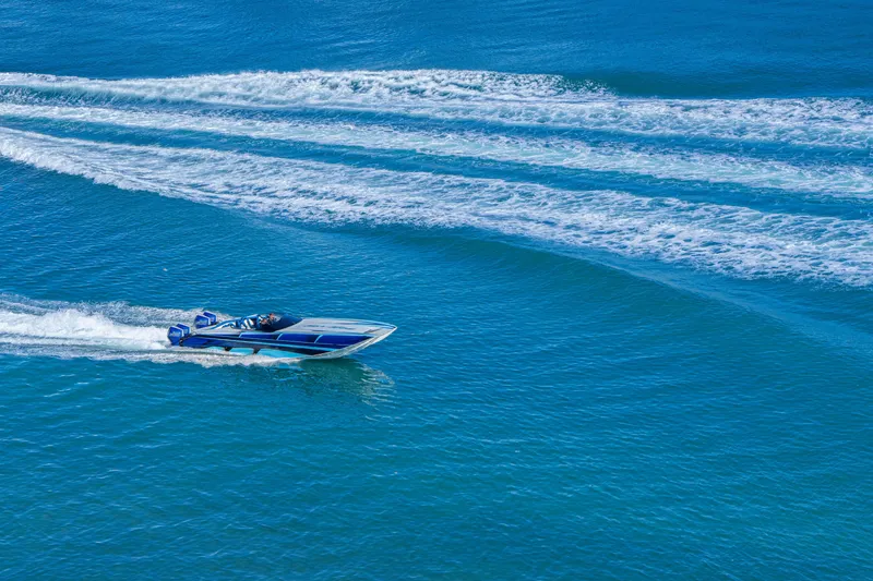 Slide: The Image of 2026 Nor-Tech 4000 Super Catamaran speeding on blue ocean waters. - 200