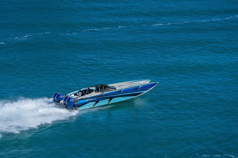 Slide: The Image of 2026 Nor-Tech 4000 Super Catamaran speeding on open blue water. - 201