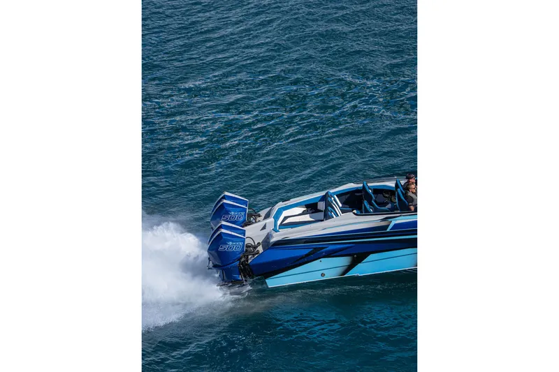 Slide: The Image of 2026 Nor-Tech 4000 Super Catamaran speeding on water with powerful engines. - 203