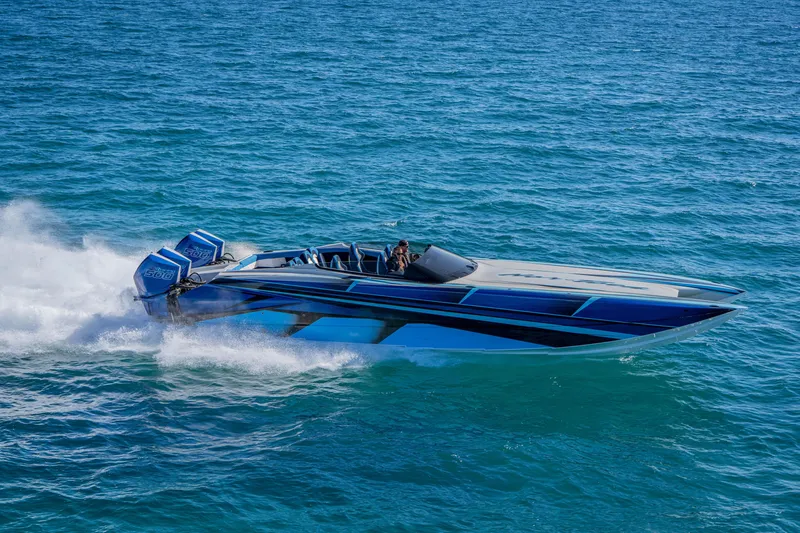 Slide: The Image of 2026 Nor-Tech 4000 Super Catamaran speeding on open water, showcasing sleek design and power. - 208