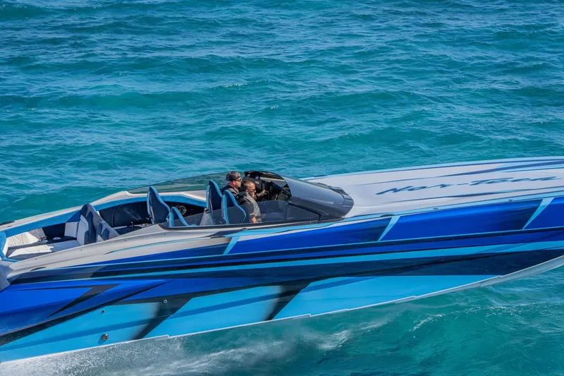 Slide: The Image of 2026 Nor-Tech 4000 Super Catamaran cruising on vibrant blue ocean waters. - 210