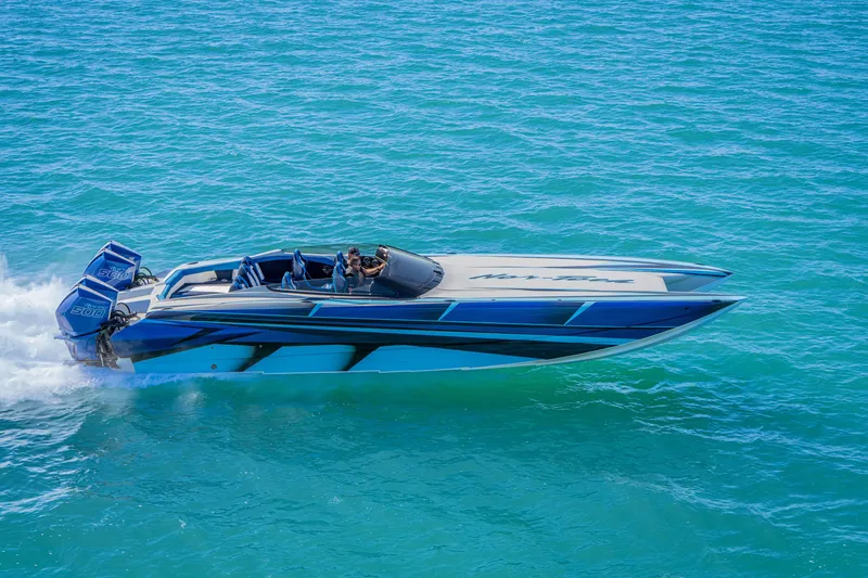 Slide: The Image of 2026 Nor-Tech 4000 Super Catamaran cruising on clear blue water. - 211