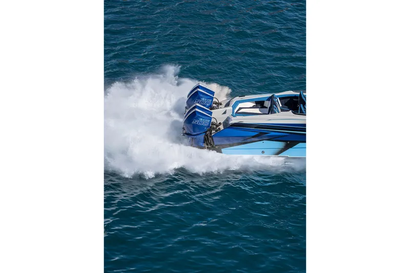 Slide: The Image of 2026 Nor-Tech 4000 Super Catamaran speeding on water, showcasing powerful engines. - 218