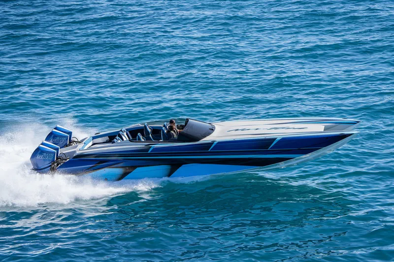 Slide: The Image of 2026 Nor-Tech 4000 Super Catamaran speeding on blue ocean waters. - 219