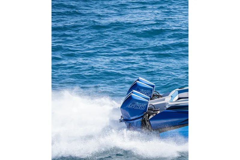 Slide: The Image of 2026 Nor-Tech 4000 Super Catamaran with twin Racing 500 engines on blue ocean. - 26