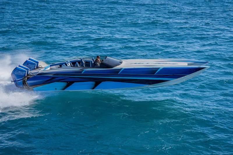 Slide: The Image of 2026 Nor-Tech 4000 Super Catamaran speeding on open water, showcasing sleek design. - 28