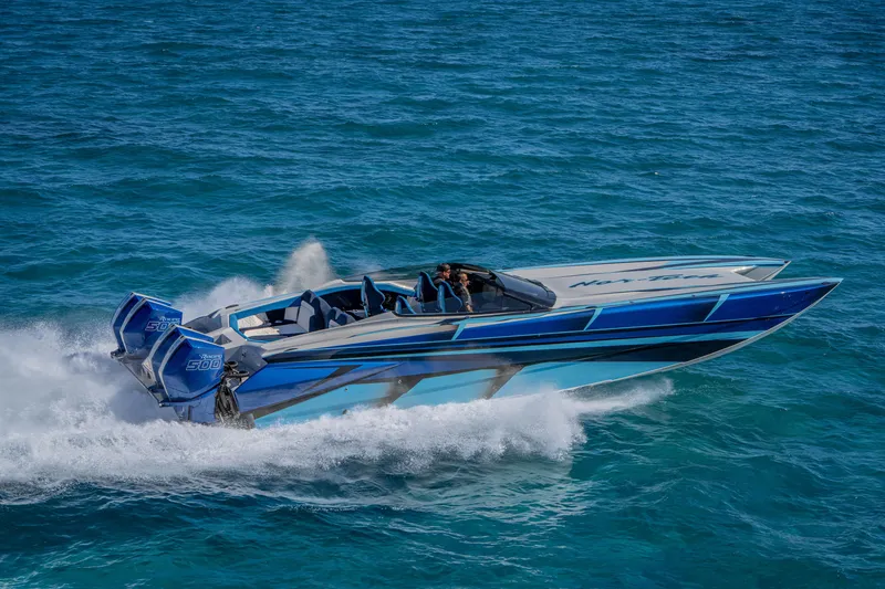 Slide: The Image of 2026 Nor-Tech 4000 Super Catamaran speeding on ocean waters. - 29
