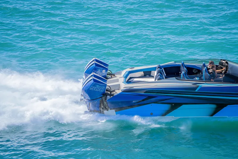 Slide: The Image of 2026 Nor-Tech 4000 Super Catamaran speeding on blue ocean waters. - 31