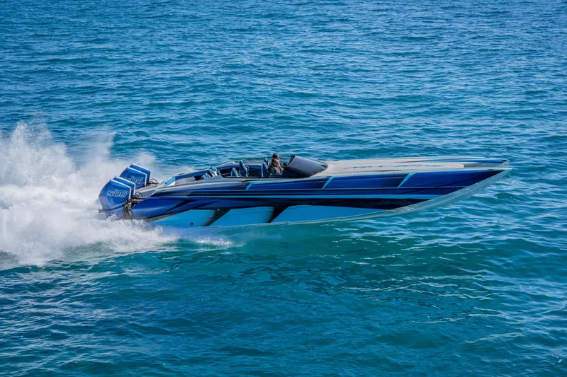 Slide: The Image of 2026 Nor-Tech 4000 Super Catamaran speeding on blue ocean waters. - 44