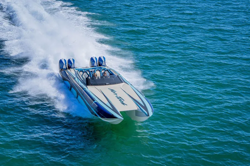 Slide: The Image of 2026 Nor-Tech 4000 Super Catamaran speeding on open water. - 49