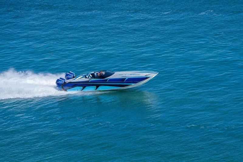 Slide: The Image of 2026 Nor-Tech 4000 Super Catamaran speeding on blue ocean waters. - 5