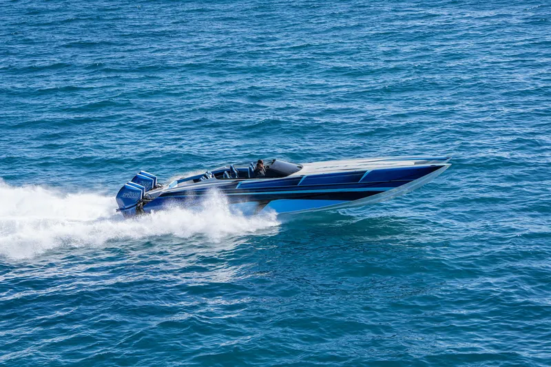 Slide: The Image of 2026 Nor-Tech 4000 Super Catamaran speeding on open water, showcasing sleek design and power. - 56