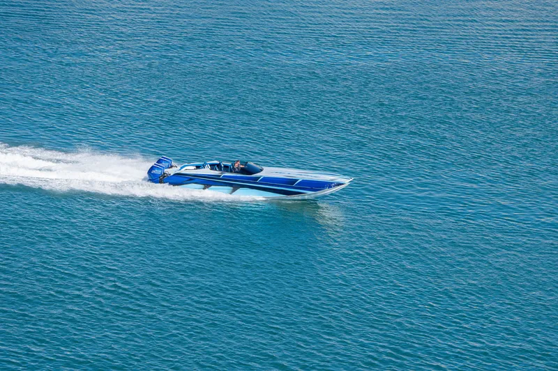 Slide: The Image of 2026 Nor-Tech 4000 Super Catamaran speeding on blue water. - 67