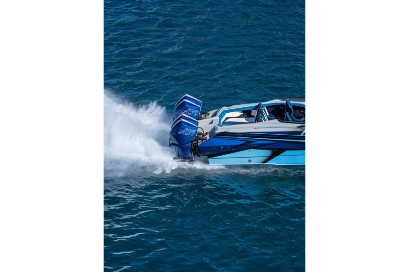 Slide: The Image of 2026 Nor-Tech 4000 Super Catamaran speeding on blue ocean waters. - 69