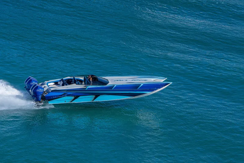 Slide: The Image of 2026 Nor-Tech 4000 Super Catamaran speeding on blue ocean waters. - 7