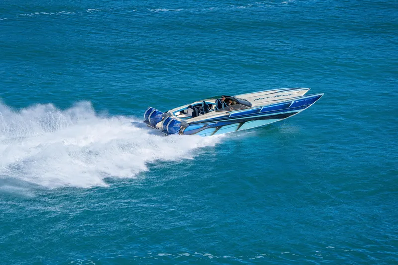 Slide: The Image of 2026 Nor-Tech 4000 Super Catamaran speeding on blue ocean waters. - 8