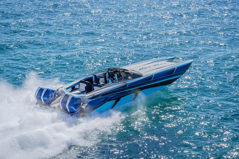 Slide: The Image of 2026 Nor-Tech 4000 Super Catamaran speeding on open water, showcasing sleek design and power. - 80