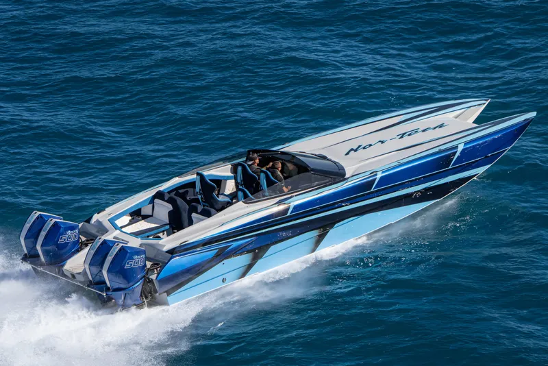 Slide: The Image of 2026 Nor-Tech 4000 Super Catamaran speeding on blue ocean waters. - 87