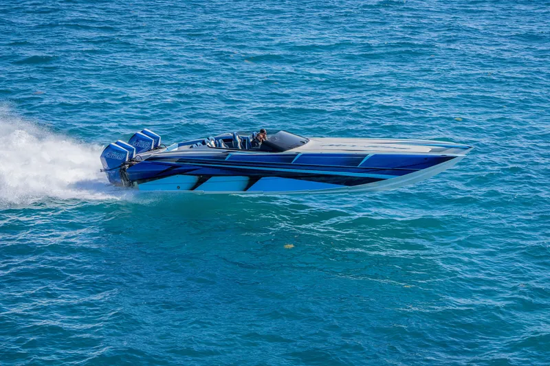 Slide: The Image of 2026 Nor-Tech 4000 Super Catamaran speeding on blue ocean waters. - 91