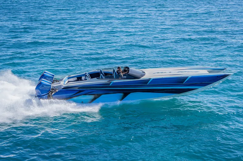 Slide: The Image of 2026 Nor-Tech 4000 Super Catamaran speeding on open water, showcasing sleek design. - 92