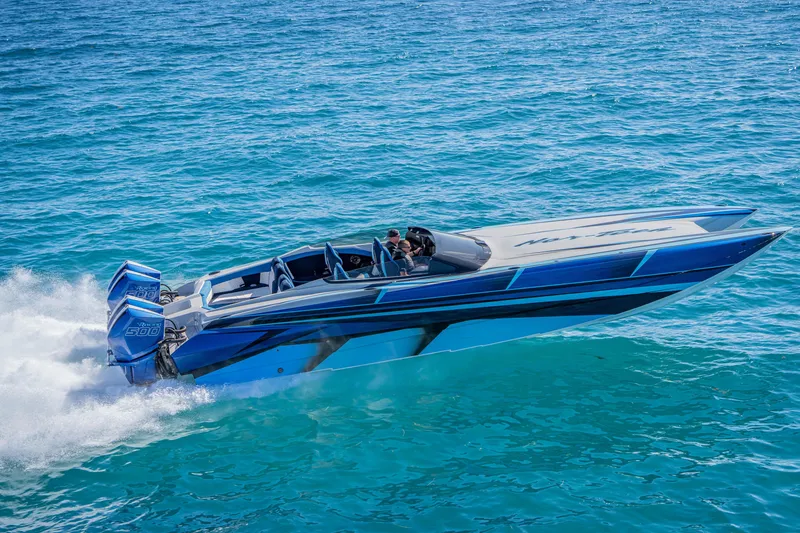 Slide: The Image of 2026 Nor-Tech 4000 Super Catamaran speeding on clear blue ocean waters. - 93