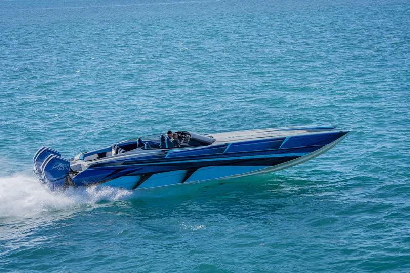 Slide: The Image of 2026 Nor-Tech 4000 Super Catamaran cruising on open water, showcasing sleek design. - 97