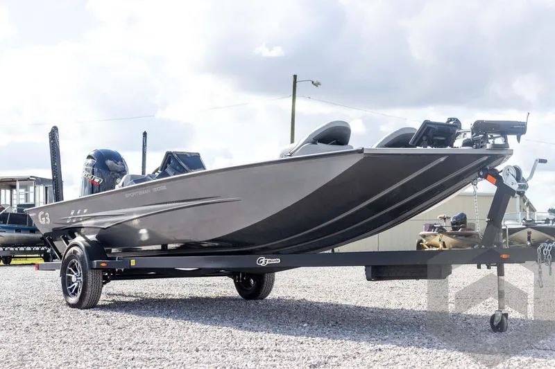 Slide: The Image of 2026 G3 Sportsman 1910 SE boat on trailer, parked on gravel lot. - 14