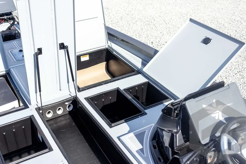Slide: The Image of 2026 G3 Sportsman 1910 SE boat storage compartments and console detail. - 29