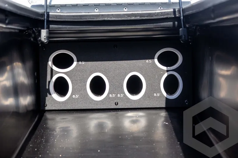 Slide: The Image of 2026 G3 Sportsman 1910 SE rod storage compartment with multiple circular holders. - 30