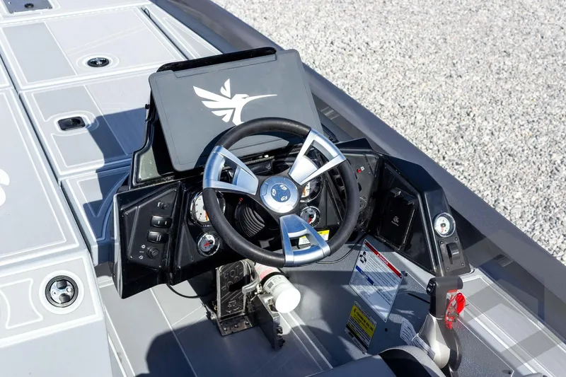 Slide: The Image of 2026 G3 Sportsman 1910 SE boat dashboard with steering wheel and control panel. - 39
