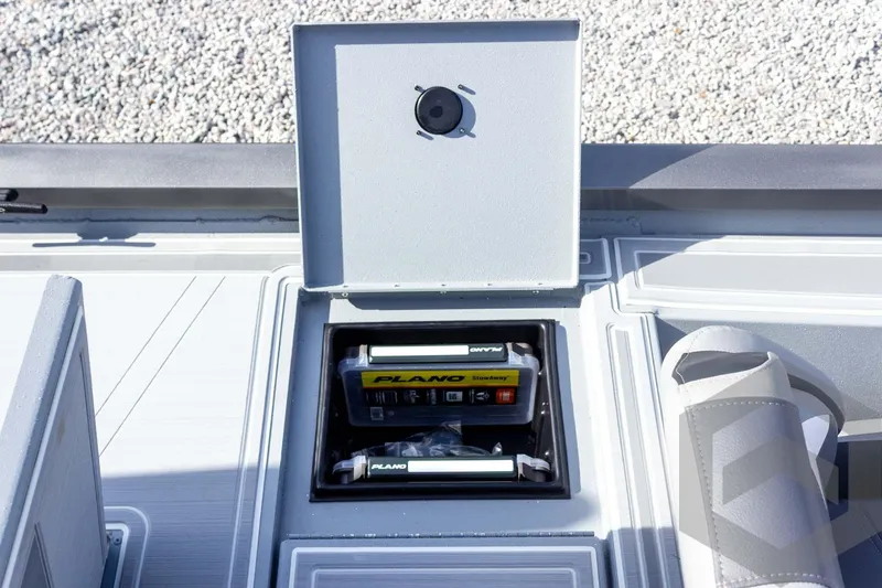Slide: The Image of 2026 G3 Sportsman 1910 SE boat storage compartment with Plano tackle boxes. - 53