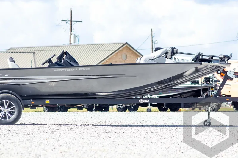 Slide: The Image of 2026 G3 Sportsman 1910 SE boat on trailer, side view, outdoors. - 6