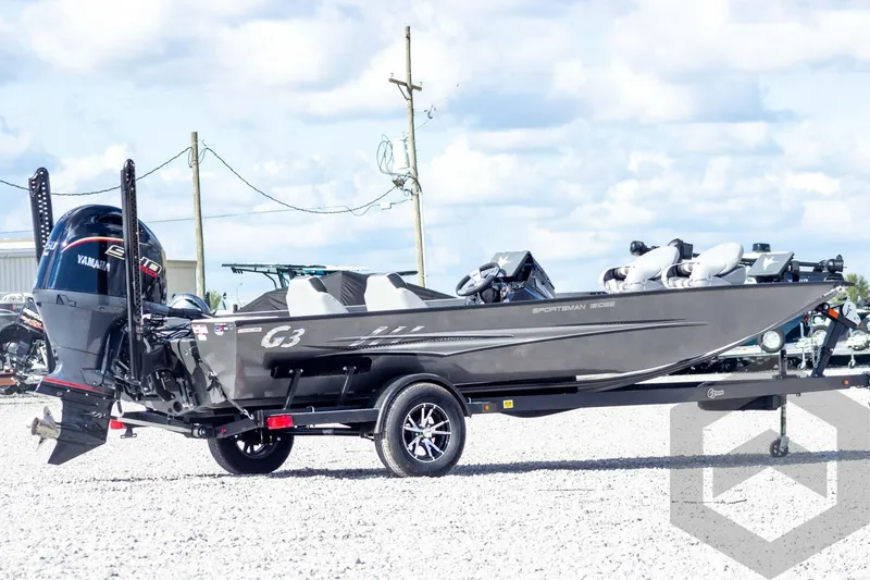 Slide: The Image of 2026 G3 Sportsman 1910 SE boat on trailer, featuring Yamaha engine, parked outdoors. - 7