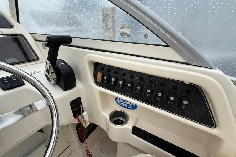 Slide: The Image of 2020 Grady-White Adventure 208 boat dashboard with controls and steering wheel. - 15
