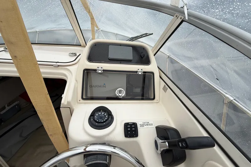 Slide: The Image of 2020 Grady-White Adventure 208 boat dashboard with Garmin navigation system. - 16