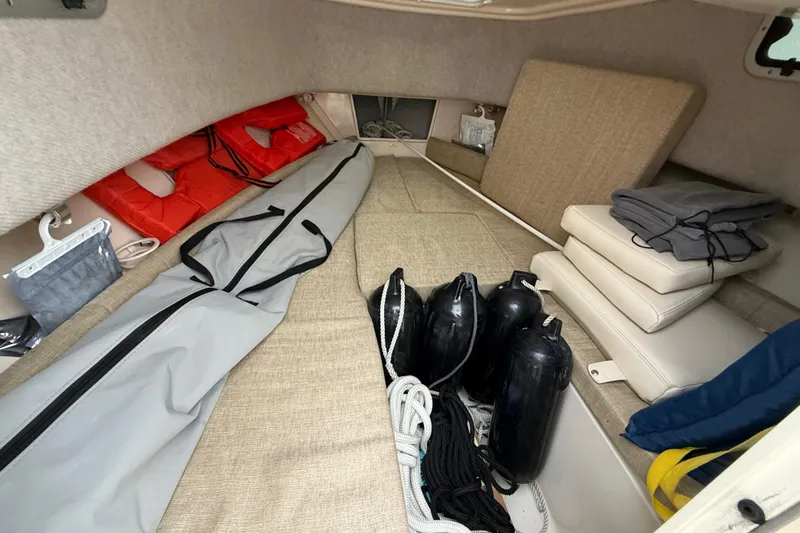 Slide: The Image of Interior of 2020 Grady-White Adventure 208 boat with life jackets and equipment. - 17