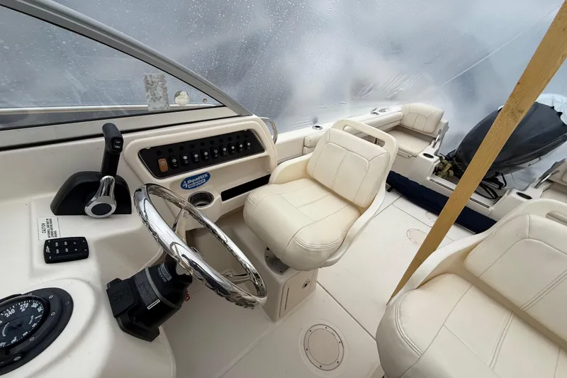 Slide: The Image of 2020 Grady-White Adventure 208 boat interior with steering wheel and seating. - 18