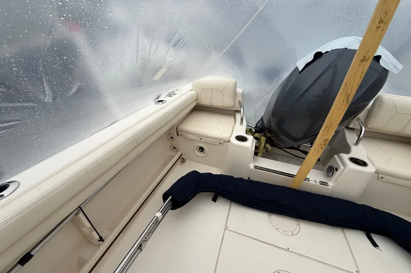 Slide: The Image of 2020 Grady-White Adventure 208 boat interior with covered engine and seating. - 20