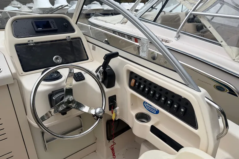 Slide: The Image of Helm console of a 2020 Grady-White Adventure 208 boat. - 3