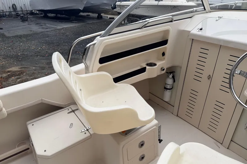 Slide: The Image of 2020 Grady-White Adventure 208 boat interior with seating and storage compartments. - 4