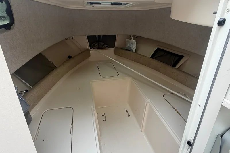 Slide: The Image of 2020 Grady-White Adventure 208 boat cabin interior with storage compartments. - 7
